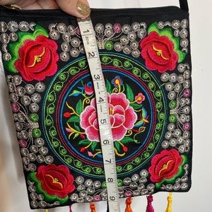 Black canvas and brightly colored embroidered purse